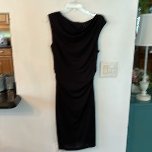 Slimming black dress with a crunch center around the lower the back